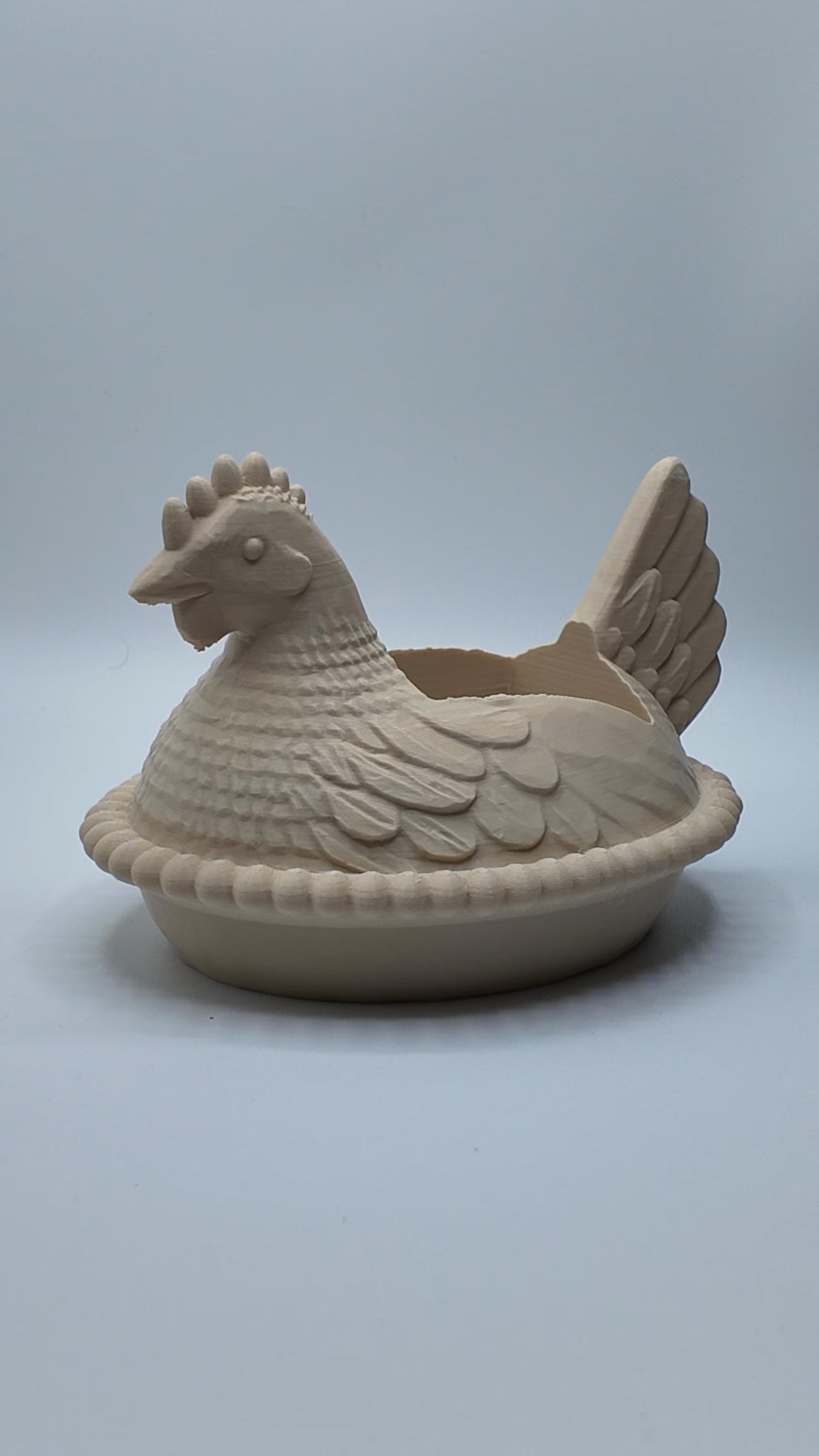 Beige chicken soap dispenser holder for a farmhouse sink