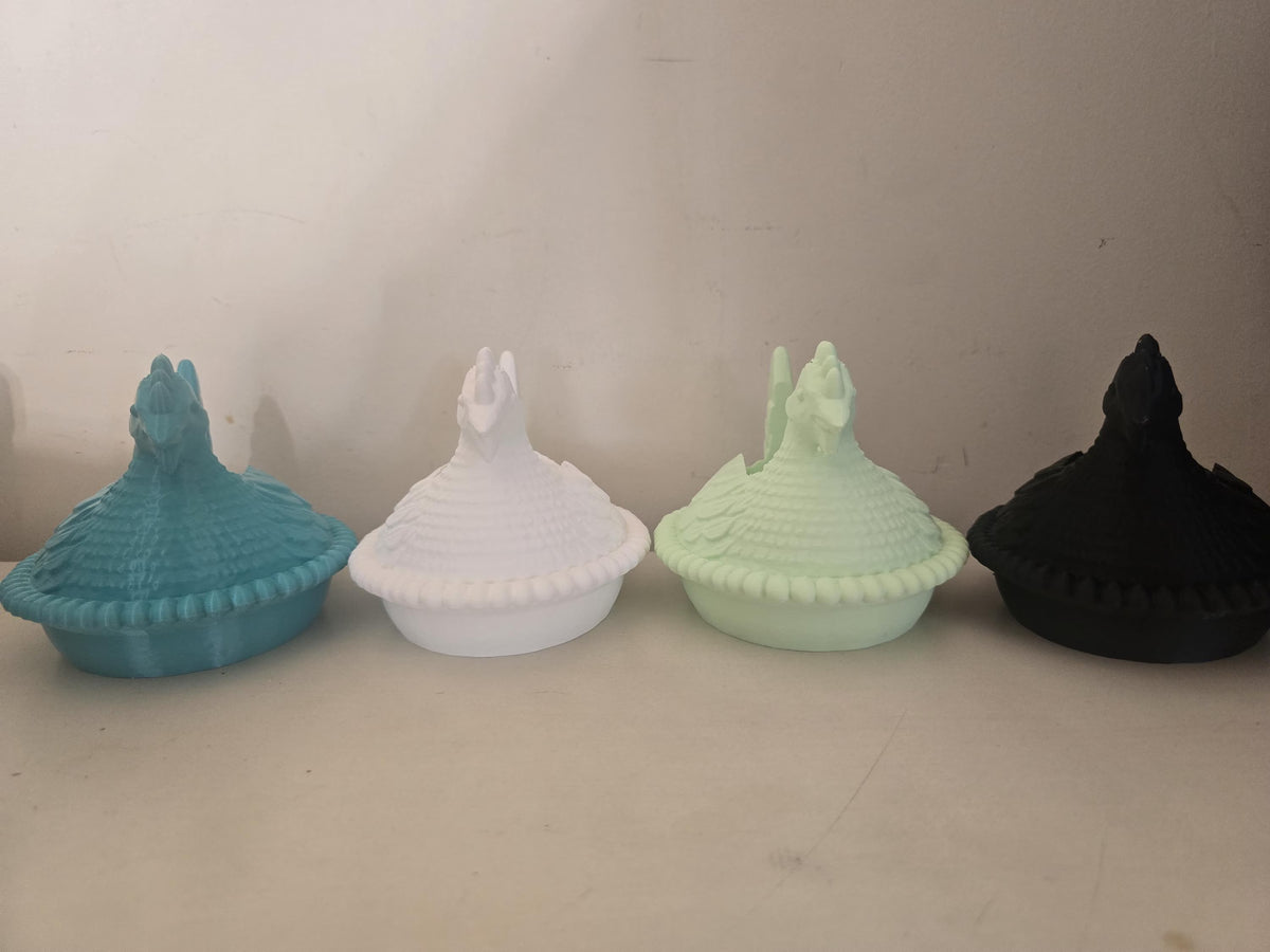 Group of chicken soap holders in several colors