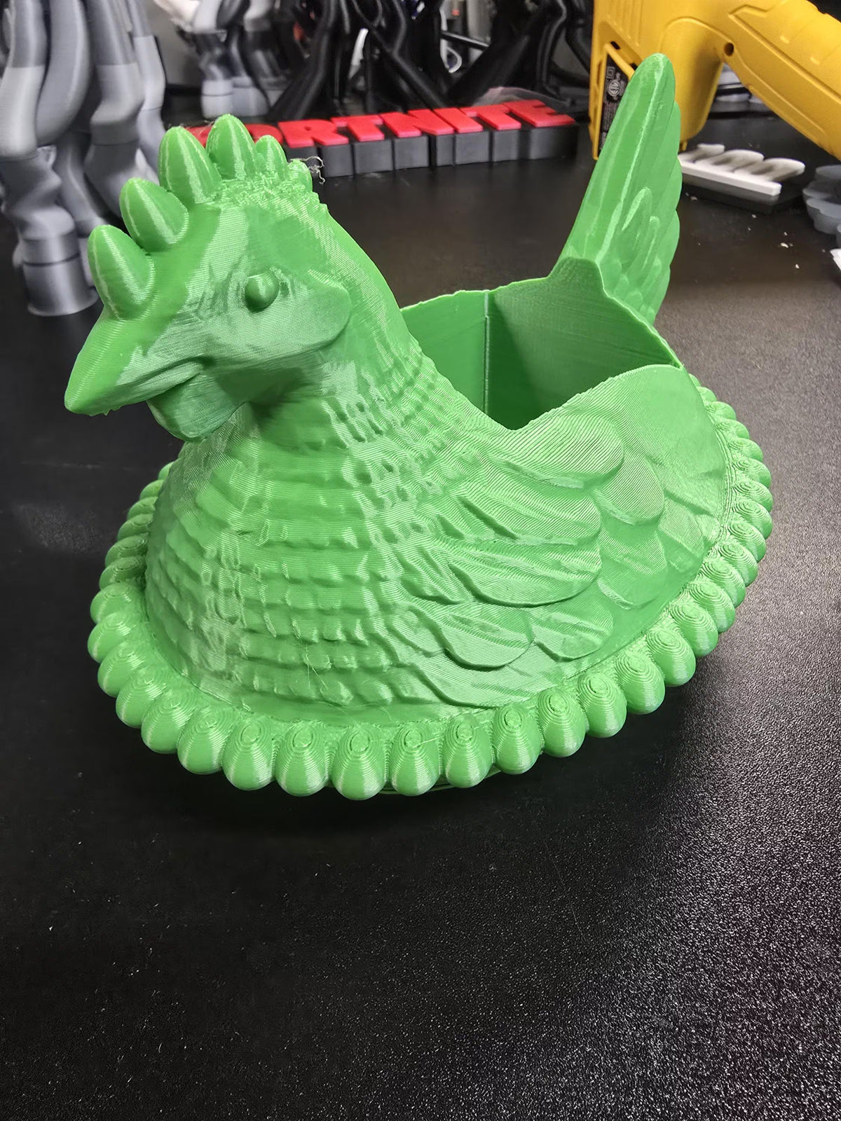 Green chicken soap dispenser holder with a Bath & Body Works foaming pump