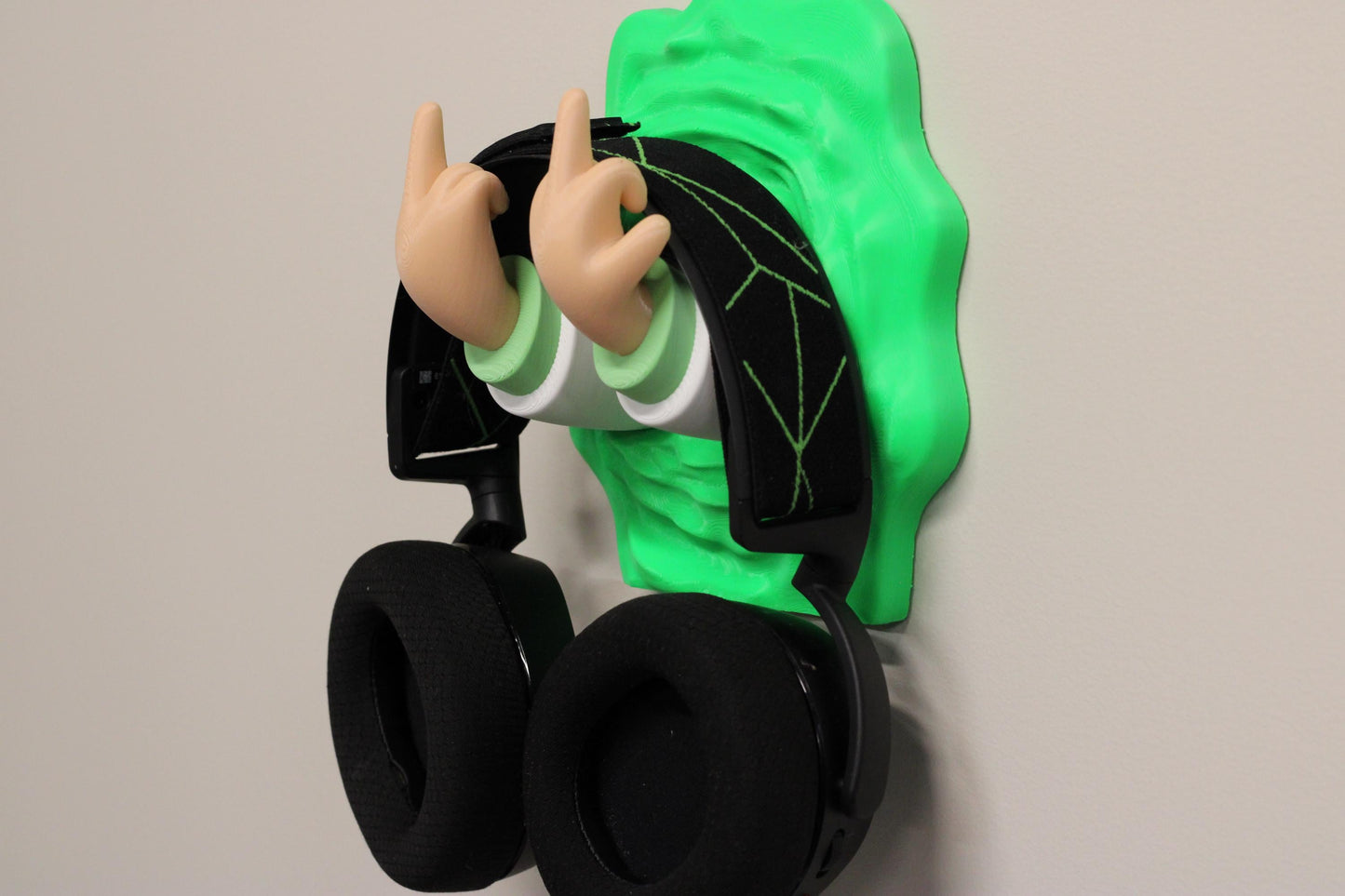 Headphone holder mounted on a wall