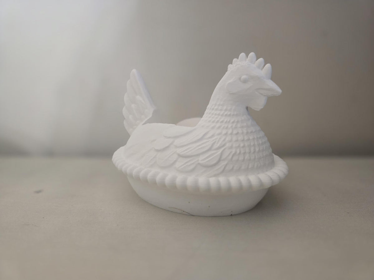 White chicken soap dispenser holder on a counter