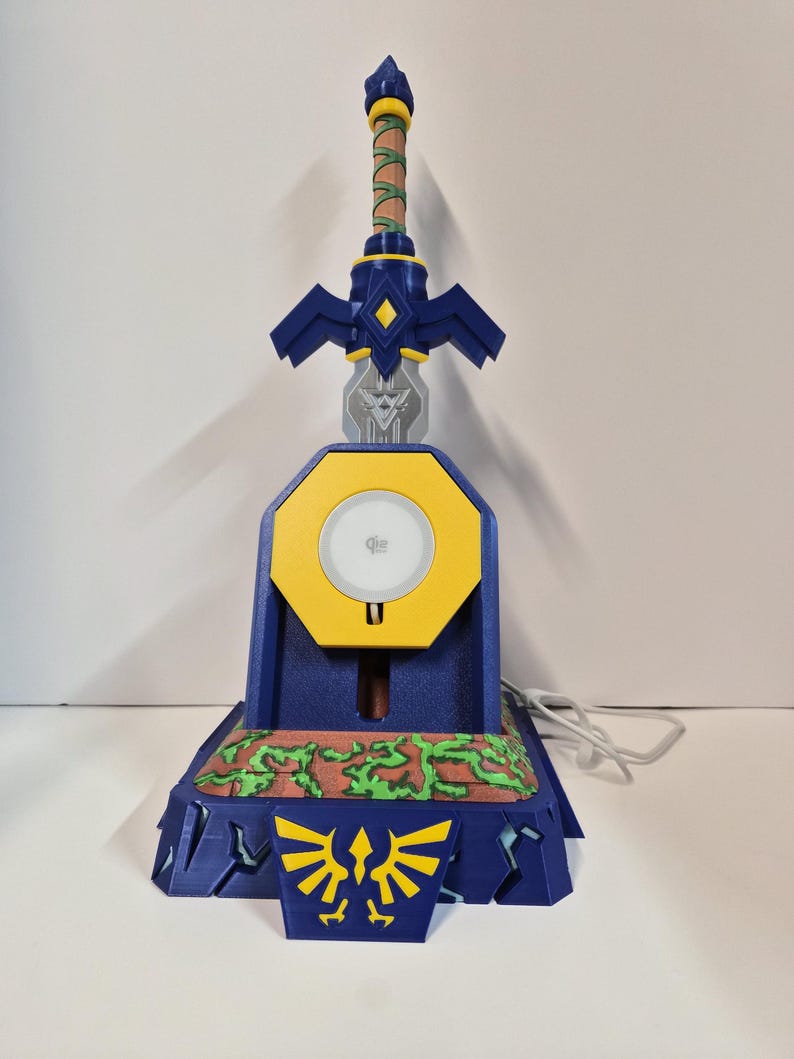 Sword in stone charging stand showing the Qi wireless charging pad