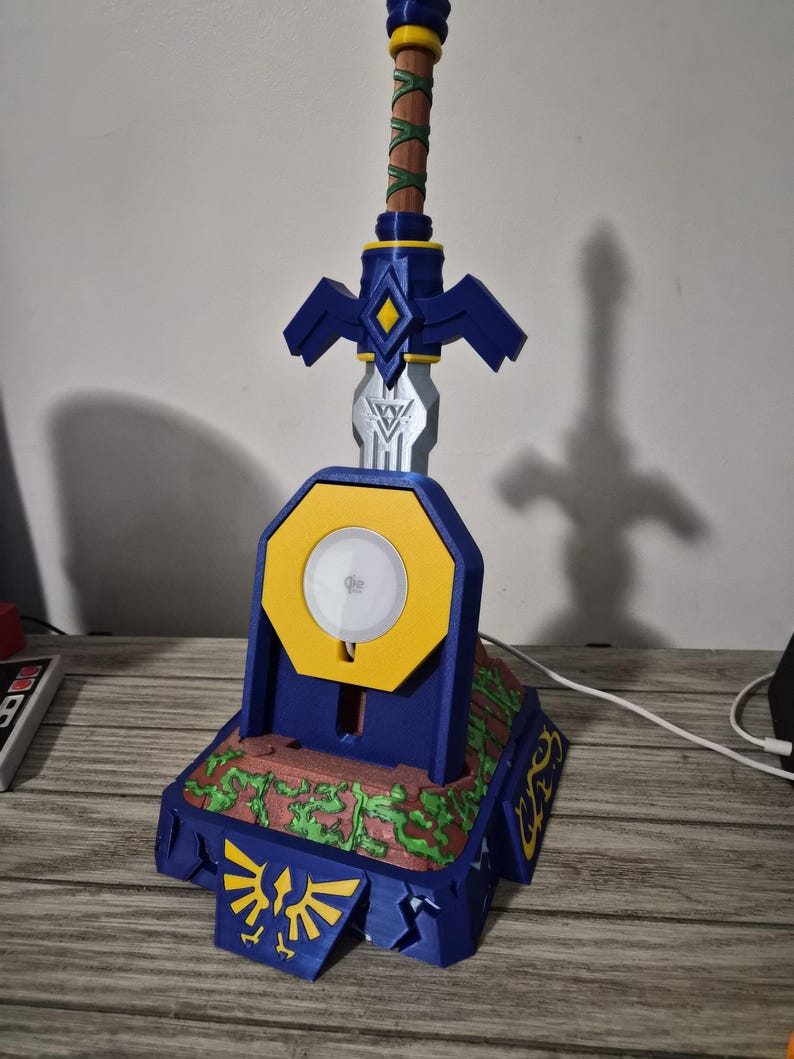 Front view of sword pedestal charger with circular wireless charging pad