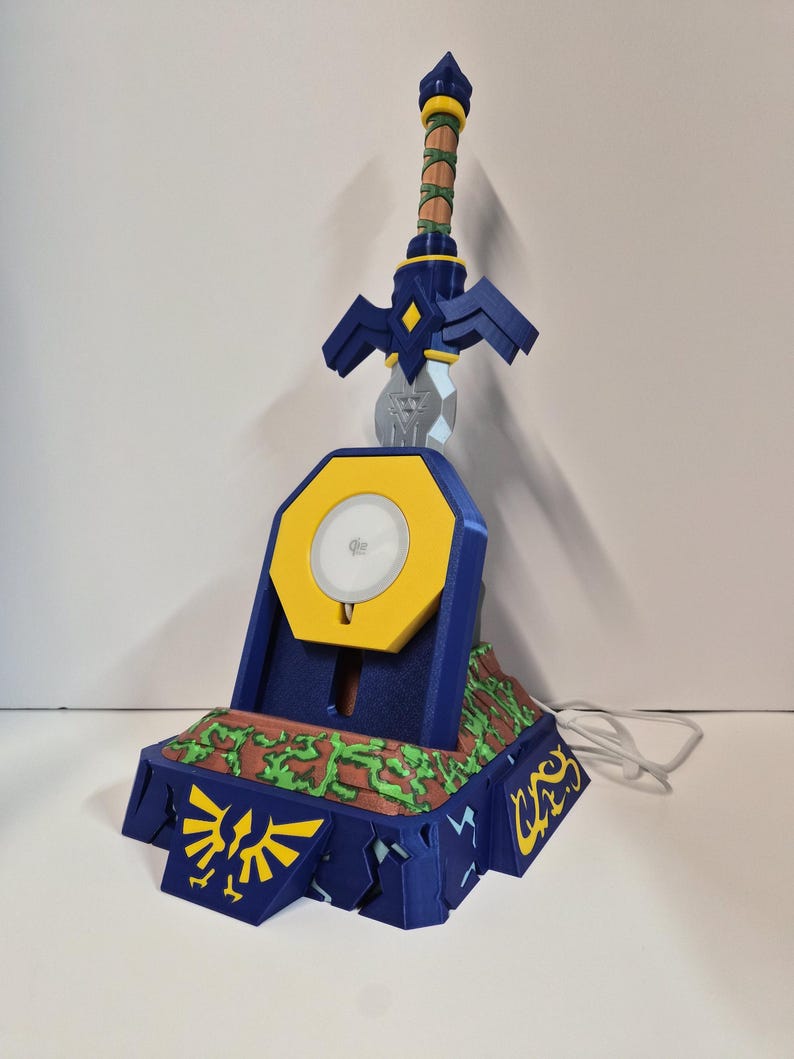 Blue and yellow sword charging stand with green and brown handle detail
