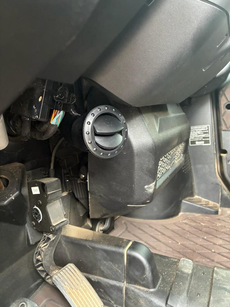 Close view of the vent redirector showing the deflector angle