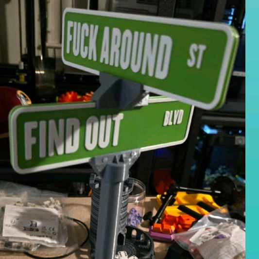 Mini street sign shown on a wall