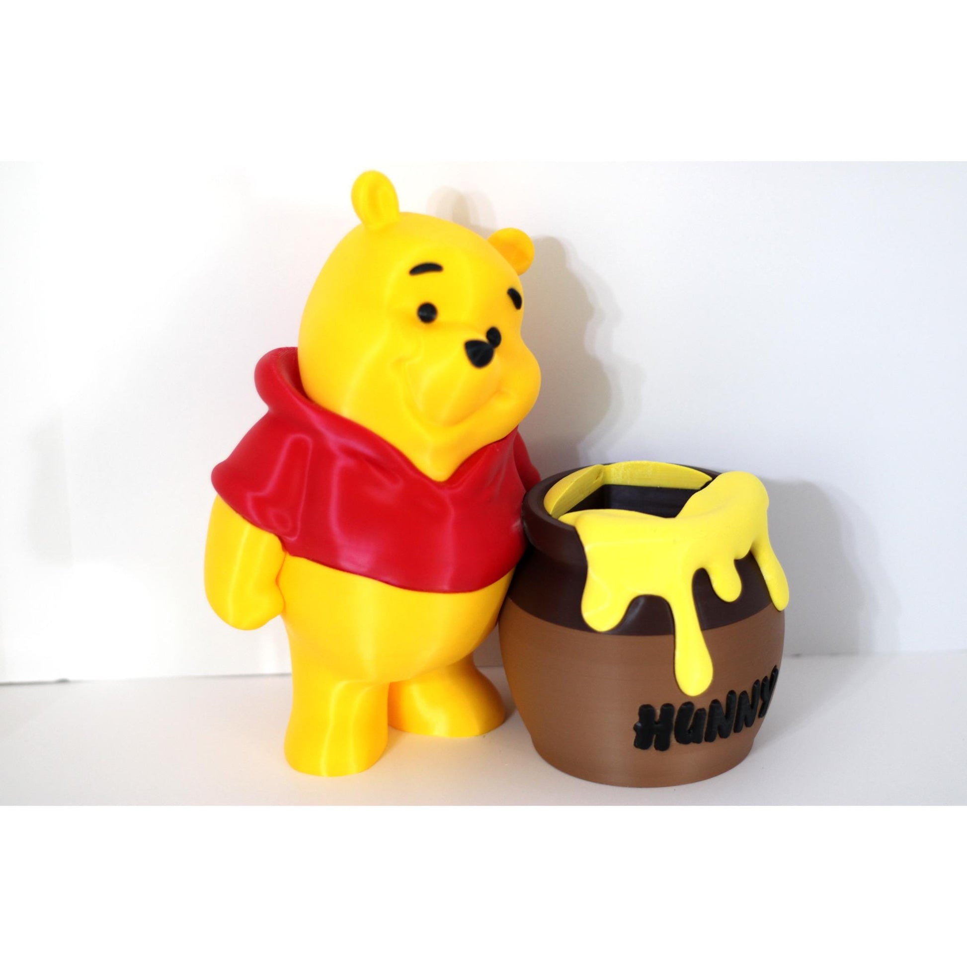 Bear figure shown beside the pot