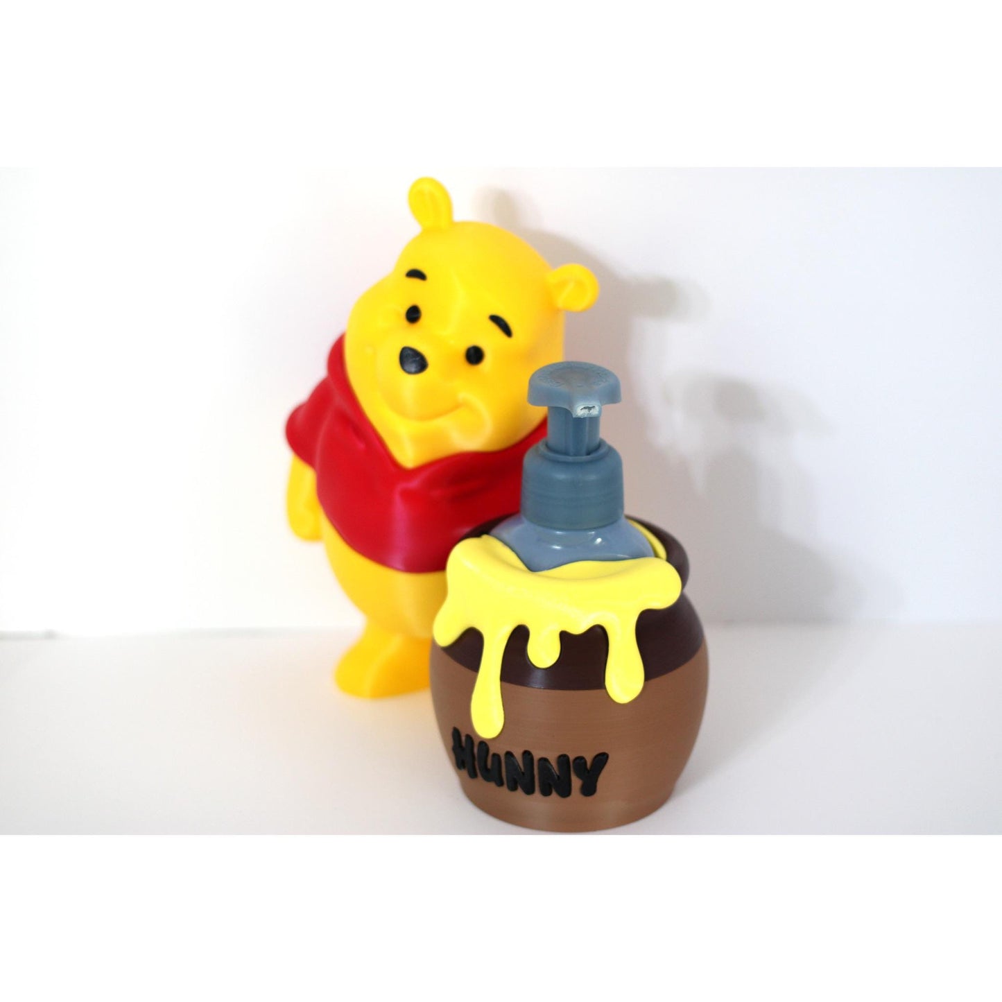Honey pot soap dispenser on a counter