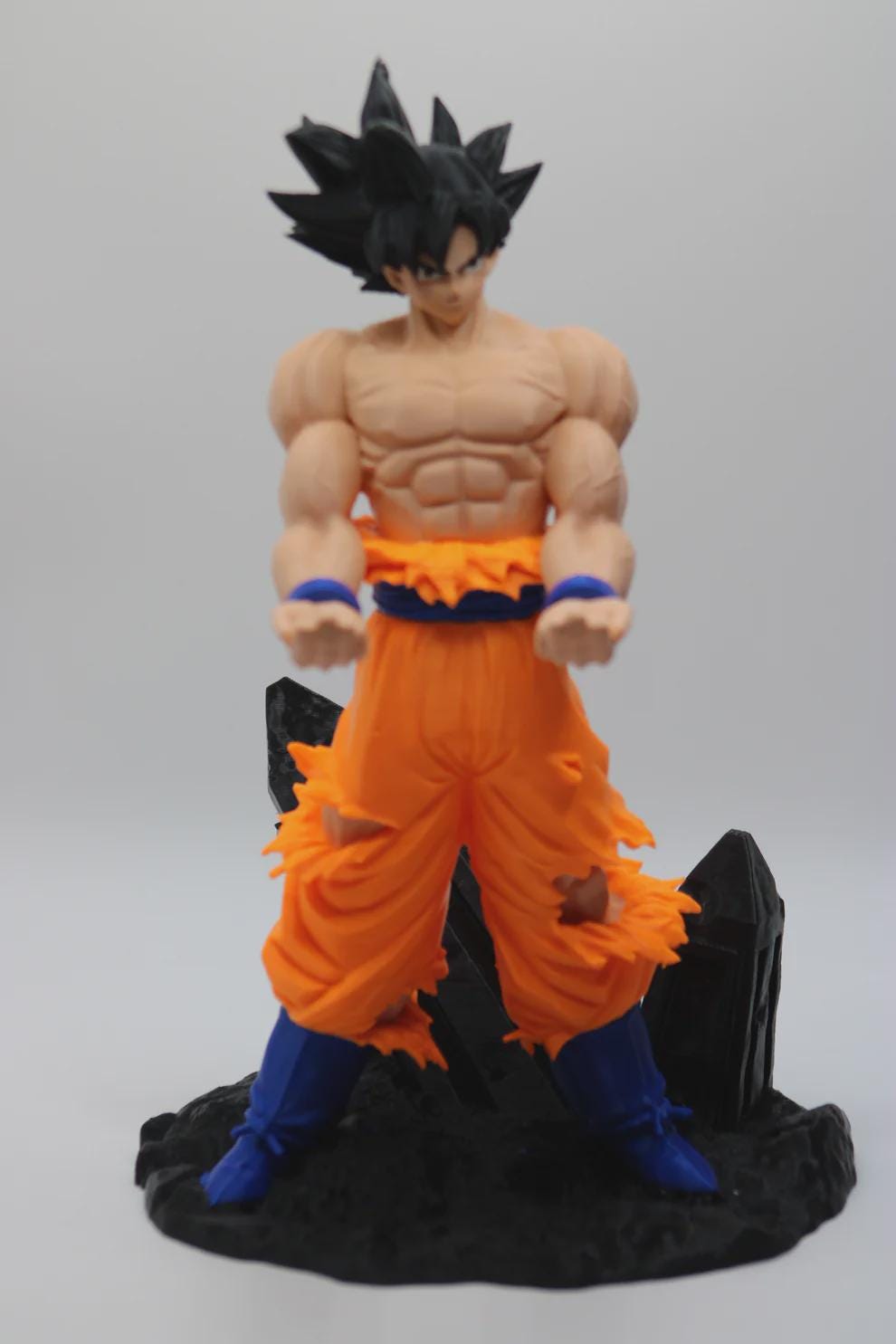 Detail of the shredded gi and obsidian base