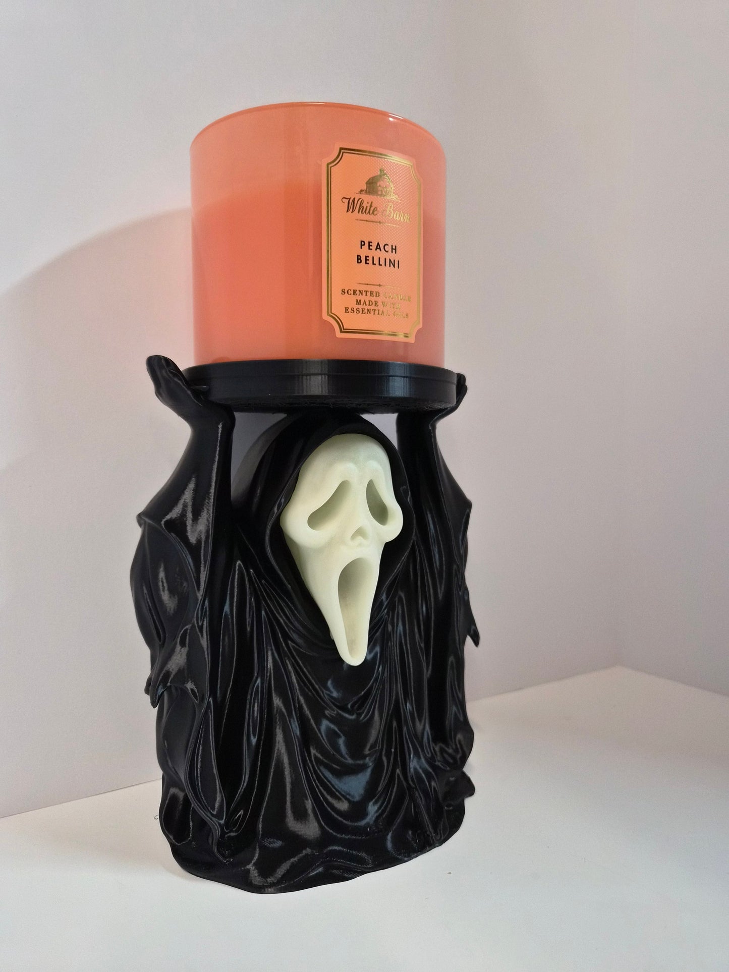 Phantom candle holder at an angle showing draped robe detail