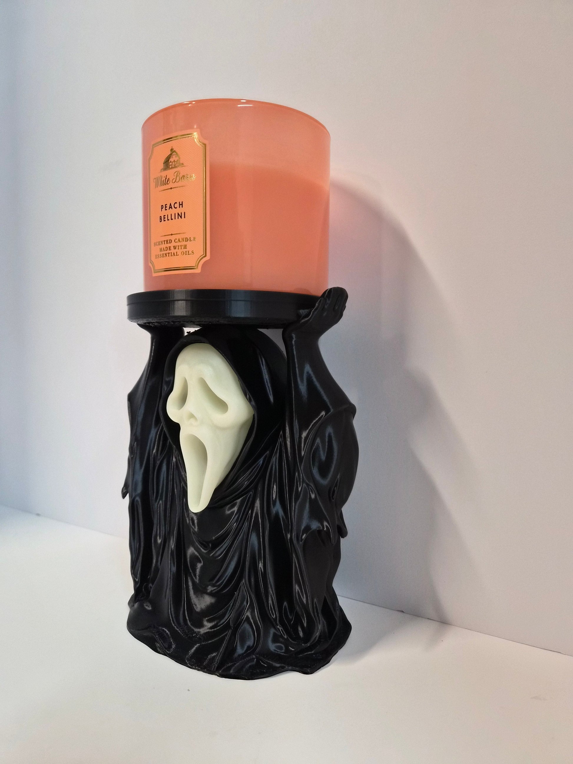 Side profile of the phantom candle holder with jar candle on the tray