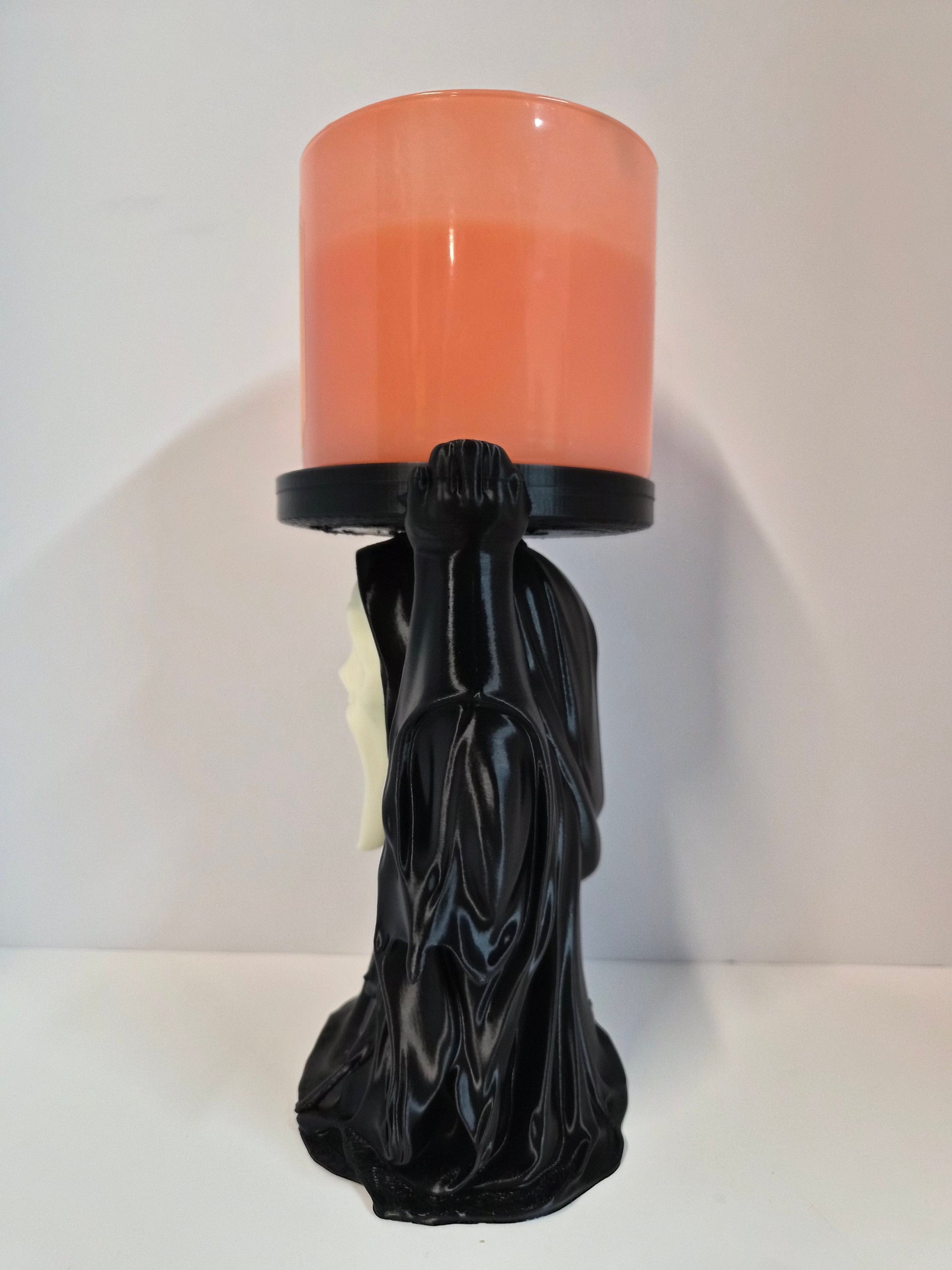 Back view showing the raised arms supporting the candle tray