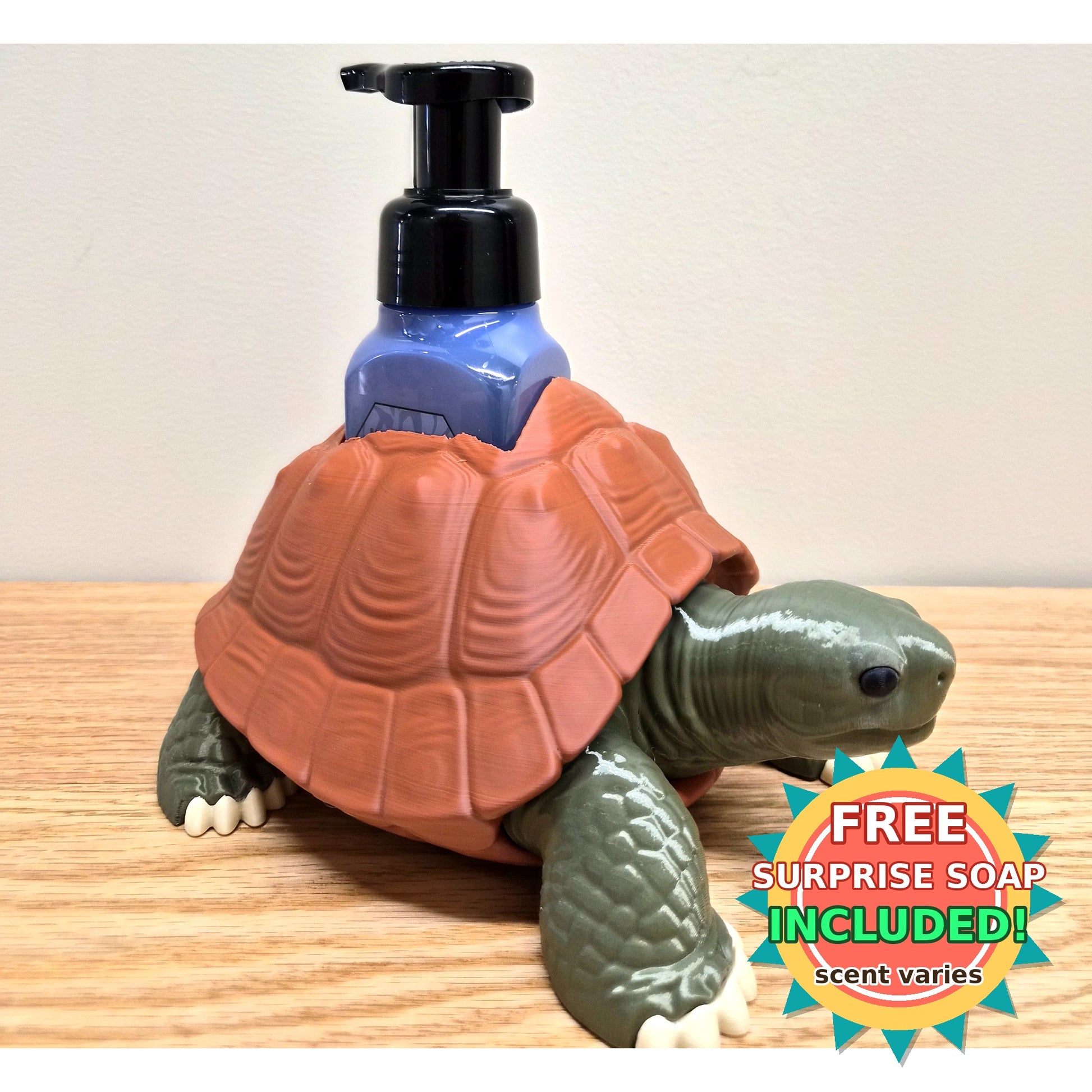 Three-quarter view of tortoise soap dispenser holder, free surprise soap badge