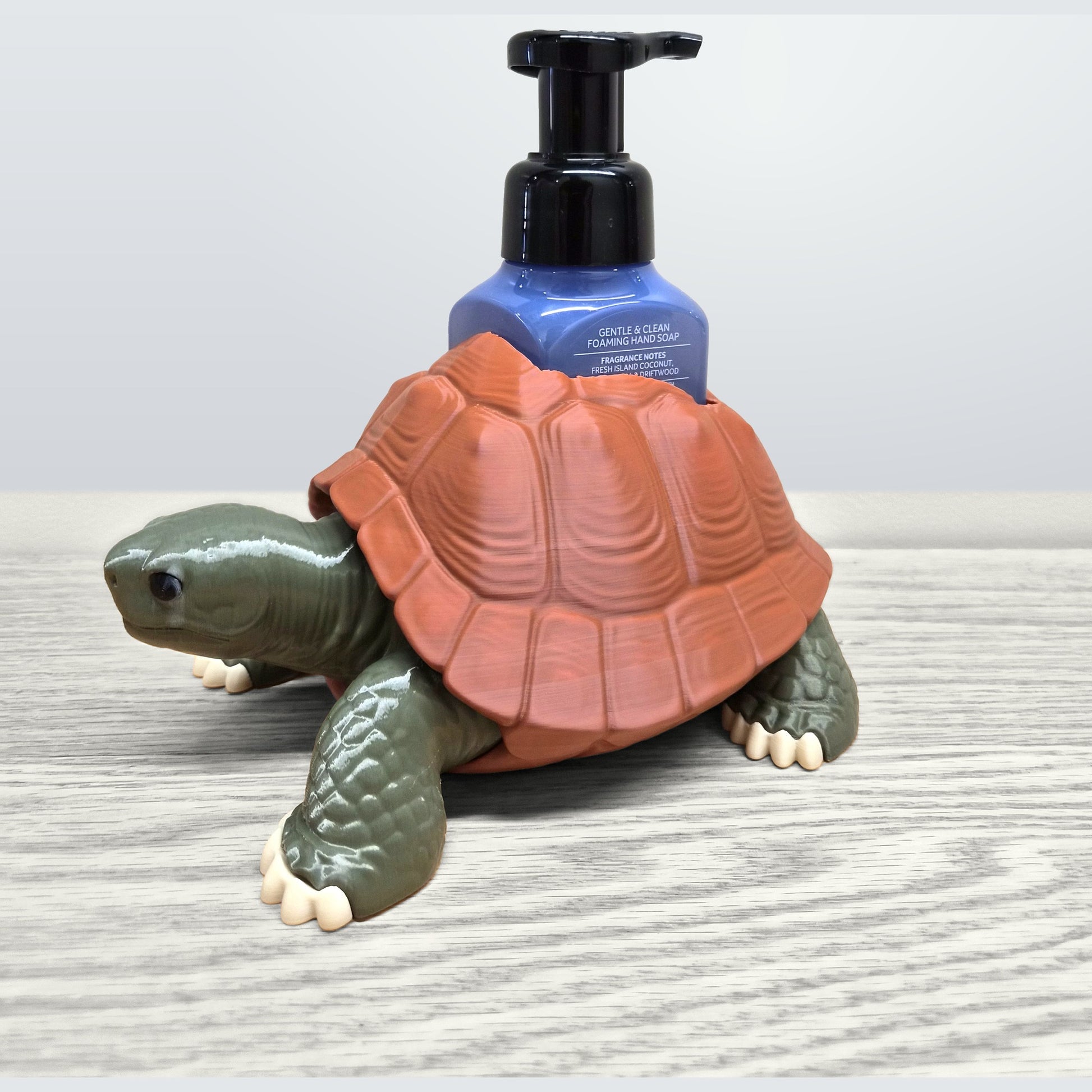Tortoise soap dispenser holder styled on a bathroom vanity counter